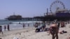 Santa Monica Pier is 25 km from downtown Los Angeles. It is a place frequented by locals and tourists alike. (E. Lee/VOA)