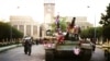 FILE - In this Sept. 28, 1996, photo, tanks manned by Taliban fighters and decorated with flowers are seen in front of the the presidential palace in Kabul, Afghanistan. 