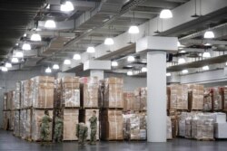 U.S. National Guard members stand beside crates of medical supplies at the Jacob Javits Center in New York, March 23, 202. New York City hospitals are 10 days from running out of "really basic supplies," Mayor Bill de Blasio said Sunday.