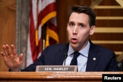 FILE - Sen. Josh Hawley, R-Mo., asks questions during a hearing in Washington, Dec. 16, 2020.