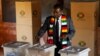 Zimbabwe's President Emmerson Mnangagwa casts his ballot as he votes in the general election at Sherwood Park Primary School in Kwekwe, Zimbabwe, July 30, 2018.