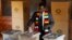Zimbabwe's President Emmerson Mnangagwa casts his ballot as he votes in the general election at Sherwood Park Primary School in Kwekwe, Zimbabwe, July 30, 2018.