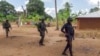 FILE - Rwandan soldiers patrol in the village of Mute, in Cabo Delgado province, Mozambique, Aug. 9, 2021.