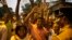 Supporters of Sri Lanka's ousted PM Ranil Wickremesinghe shout slogans as they celebrate after the Supreme Court suspended dissolution of parliament by President Sirisena, outside the court complex in Colombo, Sri Lanka, Nov. 13, 2018.