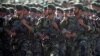 FILE - Members of Iran's Revolutionary Guards march during a military parade to commemorate the 1980-88 Iran-Iraq war in Tehran, Sept. 22, 2007.