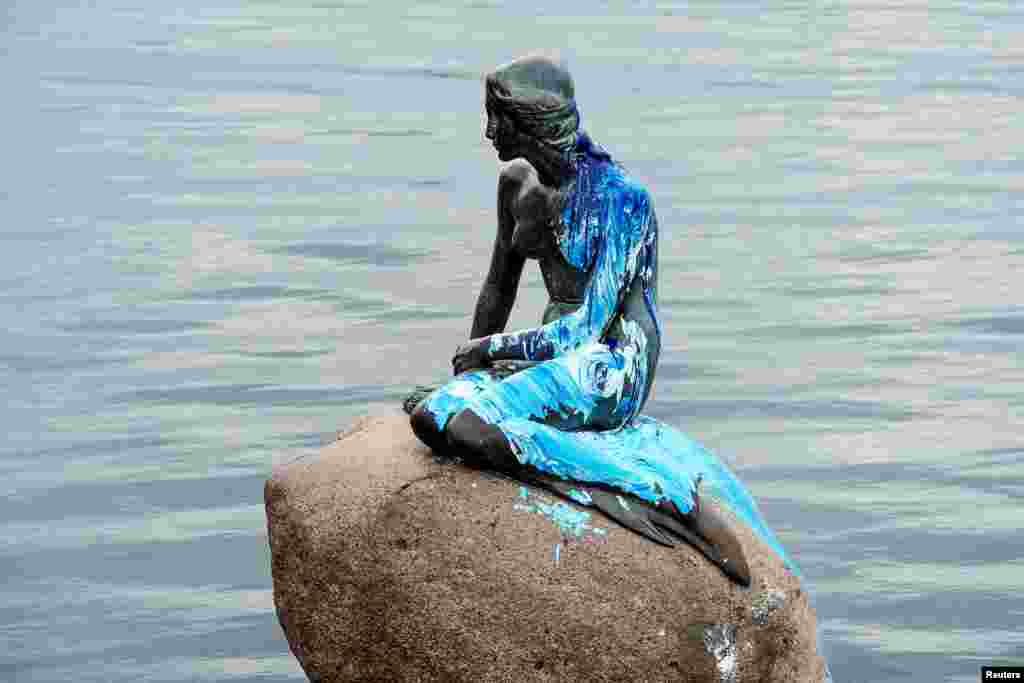 The Little Mermaid statue is seen covered in paint, for the second time in weeks, in what local authorities say is an act of vandalism, in Copenhagen, Denmark.