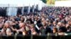 FILE - Participants take part at one of Germany's biggest right-wing music festivals in Themar, Germany, July 15, 2017.