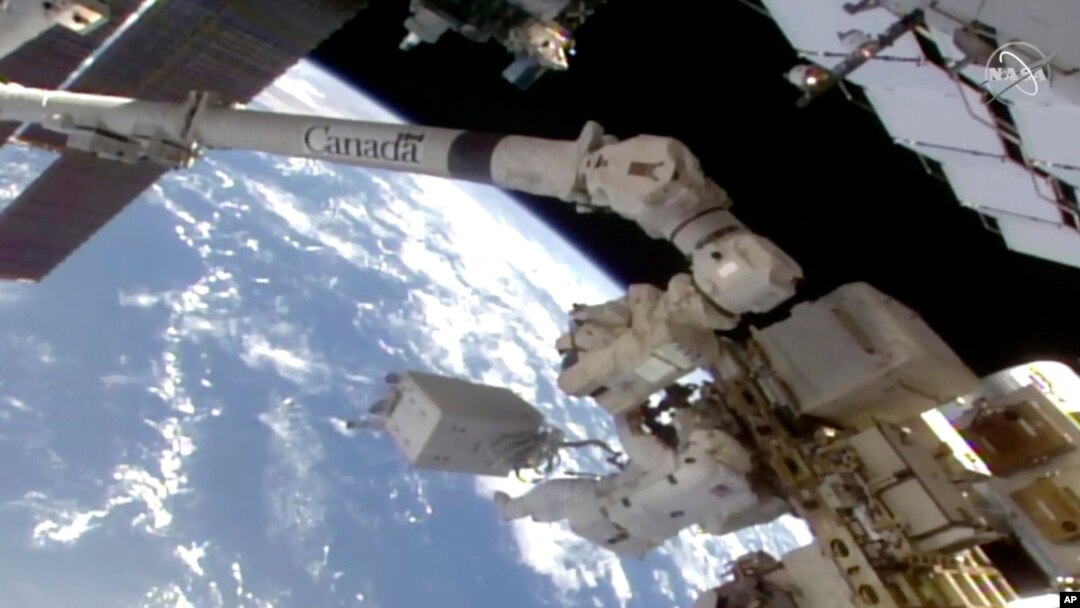 In this image taken from NASA video, NASA astronaut Victor Glover makes his way to the International Space Station’s European lab, Jan. 27, 2021.