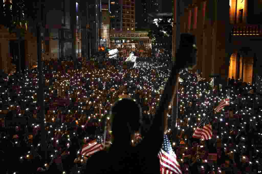 Protesters light torches during a peaceful rally in central Hong Kong&#39;s business district.