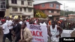 Civil society groups protest against the 104 million U.S. dollars meant for the Central Bank that went missing from the port and the airport of Monrovia between 2017 and 2018, Monrovia, Liberia, Sept. 24, 2018 in this picture obtained from a social media video. 