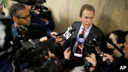 Thomas Burke, attorney for freelance journalist Bryan Carmody, answers questions after a court hearing, May 21, 2019, in San Francisco. 