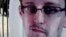 A banner supporting Edward Snowden, a former contractor at the National Security Agency (NSA), is displayed at Hong Kong's financial Central district on June 21, 2013