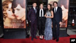 From left, Eddie Redmayne, Amber Heard, Alicia Vikander and Tom Hooper arrive at the premiere of "The Danish Girl" at Regency Village Theatre, Nov. 21, 2015, in Los Angeles, California.