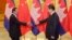 Cambodian Prime Minister Hun Sen (L) shakes hands with China's President Xi Jinping before a meeting at the Great Hall of the People in Beijing, Nov. 7, 2014.