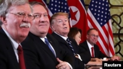 U.S. President Donald Trump, U.S. Secretary of State Mike Pompeo, White House national security adviser John Bolton and acting White House Chief of Staff Mick Mulvaney attend the extended bilateral meeting in the Metropole hotel with North Korea's leader Kim Jong Un.