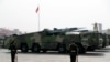 FILE - Vehicles carrying DF-17 ballistic missiles roll during a parade to commemorate the 70th anniversary of the founding of Communist China in Beijing, Oct. 1, 2019.