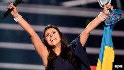 FILE - Ukraine's Jamala reacts on winning the Eurovision Song Contest final at the Ericsson Globe Arena in Stockholm, Sweden, May 14, 2016. 