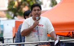 FILE - Pro-democracy activist Sirawith Seritiwat speaks during a gathering marking the fourth anniversary of a military coup in Thailand, in Bangkok, May 22, 2018. Sirawith is the second activist to have been assaulted in recent weeks.