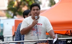 FILE - Pro-democracy activist Sirawith Seritiwat speaks during a gathering marking the fourth anniversary of a military coup in Thailand, in Bangkok, May 22, 2018. Sirawith is the second activist to have been assaulted in recent weeks.