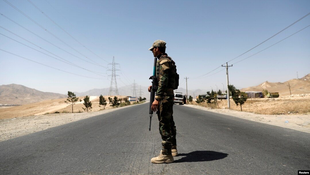 An Afghan National Army (ANA) soldier keeps watch at a checkpoint on the Ghazni highway, in Maidan Shar, the capital of Wardak province, Afghanistan, Aug. 12, 2018.