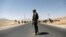 An Afghan National Army (ANA) soldier keeps watch at a checkpoint on the Ghazni highway, in Maidan Shar, the capital of Wardak province, Afghanistan, Aug. 12, 2018.