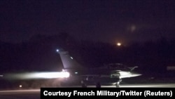 FILE - A plane preparing to take off as part of the joint airstrike operation by the British, French and U.S. militaries in Syria, is seen in this picture obtained Apr. 14, 2018, via social media. 