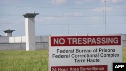 In this file photo a sign warns away trespassers at the Federal Correctional Complex Terre Haute on July 25, 2019 in Terre Haute, Indiana.