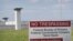 In this file photo a sign warns away trespassers at the Federal Correctional Complex Terre Haute on July 25, 2019 in Terre Haute, Indiana.
