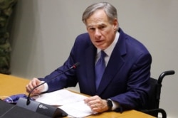 FILE - Texas Gov. Greg Abbott speaks at a news conference at city hall in Dallas, June 20, 2020.