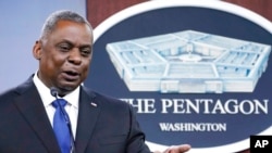 FILE - U.S. Defense Secretary Lloyd Austin speaks during a briefing at the Pentagon, outside Washington, May 6, 2021. 