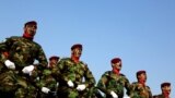 Iraqi police commandos unit march during a ceremony marking Police Day at the police academy in Baghdad.