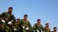Iraqi police commandos unit march during a ceremony marking Police Day at the police academy in Baghdad.