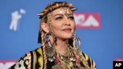 Madonna poses in the press room at the MTV Video Music Awards at Radio City Music Hall, Aug. 20, 2018, in New York.