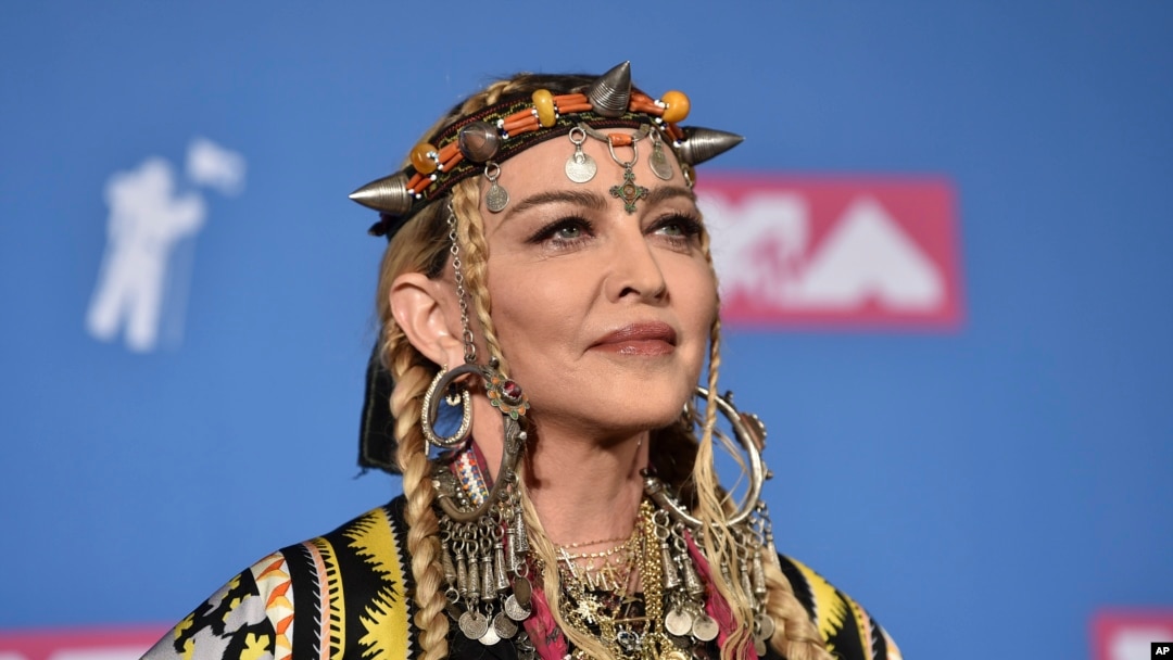 FILE - Madonna poses in the press room at the MTV Video Music Awards at Radio City Music Hall, Aug. 20, 2018, in New York.