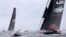 LDV Comanche, right, trails Wild Oats XI as they enter open water during the start of the Sydney Hobart yacht race in Sydney, Dec. 26, 2017.