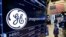 The General Electric logo appears above a trading post on the floor of the New York Stock Exchange, June 12, 2017. GE said Jeff Immelt is stepping down as CEO and John Flannery will take over the post in August. 