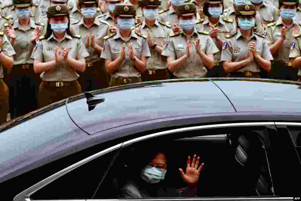 Taiwan President Tsai Ing-wen waves after inspecting the military police headquarters in Taipei.