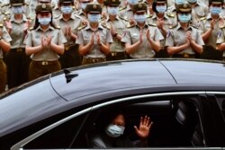 FILE - Taiwan President Tsai Ing-wen waves after inspecting the military police headquarters in Taipei on May 26, 2020.