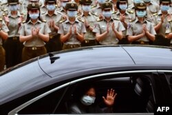 FILE - Taiwan President Tsai Ing-wen waves after inspecting the military police headquarters in Taipei on May 26, 2020.