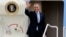 President Barack Obama waves before his departure on Air Force One from Bradley Air National Guard Base, in East Granby, Connecticut, March 5, 2014.