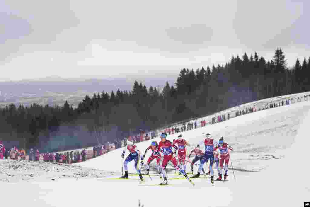 Skiers from Sweden and Austria compete in the cross-country women&#39;s mass start 50 Km at the Nordic World Ski Championships in Trondheim, Norway.