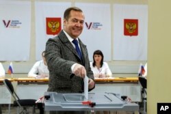 FILE — Russian Security Council Deputy Chairman and the head of the United Russia party Dmitry Medvedev casts his ballot at a polling station during a presidential election outside Moscow, Russia, March 15, 2024.