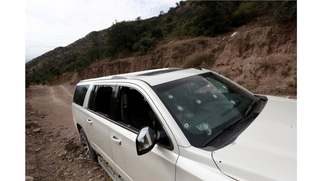 A bullet-riddled vehicle that members of the LeBaron family were traveling in sits parked on a dirt road near Bavispe, Mexico, Nov 6, 2019.