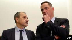 President of the Corsican assembly Gilles Simeoni (R) and French independentist Jean-Guy Talamoni talk during a meeting with French President Emmanuel Macron, Feb. 6, 2018 in Ajaccio, Corsica. 