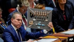 FILE - Israel’s U.N. Ambassador Gilad Erdan speaks while holding a prop during a UN Security Council meeting on January 23, 2024, at United Nations headquarters.