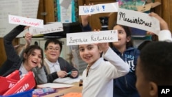 In this March 1, 2017, photo, students display some of their cursive writing work and exercises at P.S. 166 in the Queens borough of New York. 