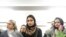 FILE - Mourners attend a vigil in memory of Iranian student Amir Moradi, who was killed in the crash of a Ukrainian passenger plane near Tehran, at Queens University in Kingston, Ontario, Canada, Jan. 10, 2020.