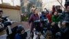 Sen. Elizabeth Warren, D-Mass., speaks to the media outside her home, Thursday, March 5, 2020, in Cambridge, Mass., after she dropped out of the Democratic presidential race. (AP Photo/Steven Senne)