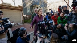 Sen. Elizabeth Warren, D-Mass., speaks to the media outside her home, Thursday, March 5, 2020, in Cambridge, Mass., after she dropped out of the Democratic presidential race. (AP Photo/Steven Senne)