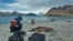 A scientist tests a dead seal on South Georgia Island in the South Atlantic Ocean for avian influenza, a disease which has already killed millions of birds and is now present in wildlife living near Antarctica, December 2023. Dr. Marco Falchieri, APHA/Handout)